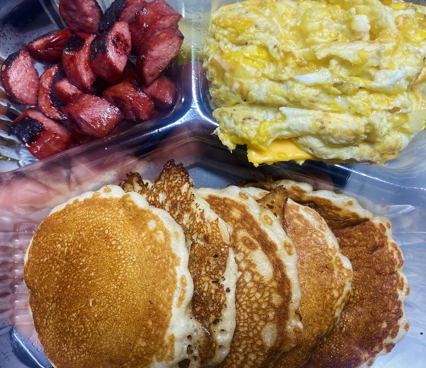 Hot cakez, scrambled eggz with cheese and grilled sausage